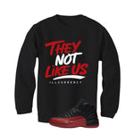 Air Jordan 12 Flu Game 2025 Black T-Shirt (They not like us)| illcurrency